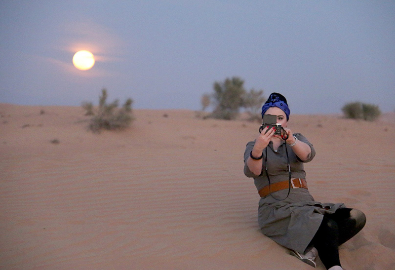 Moon rising in Dubai Desert